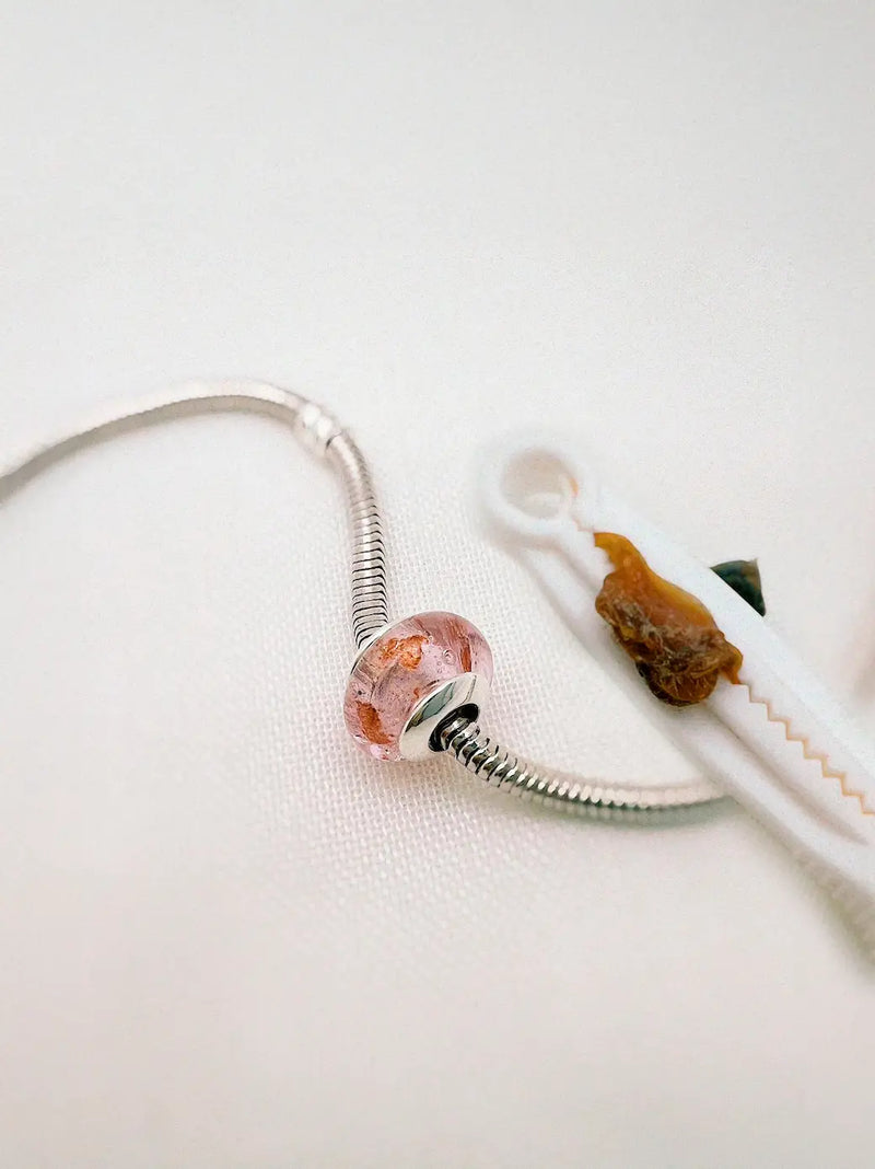 Charm con cordón umbilical